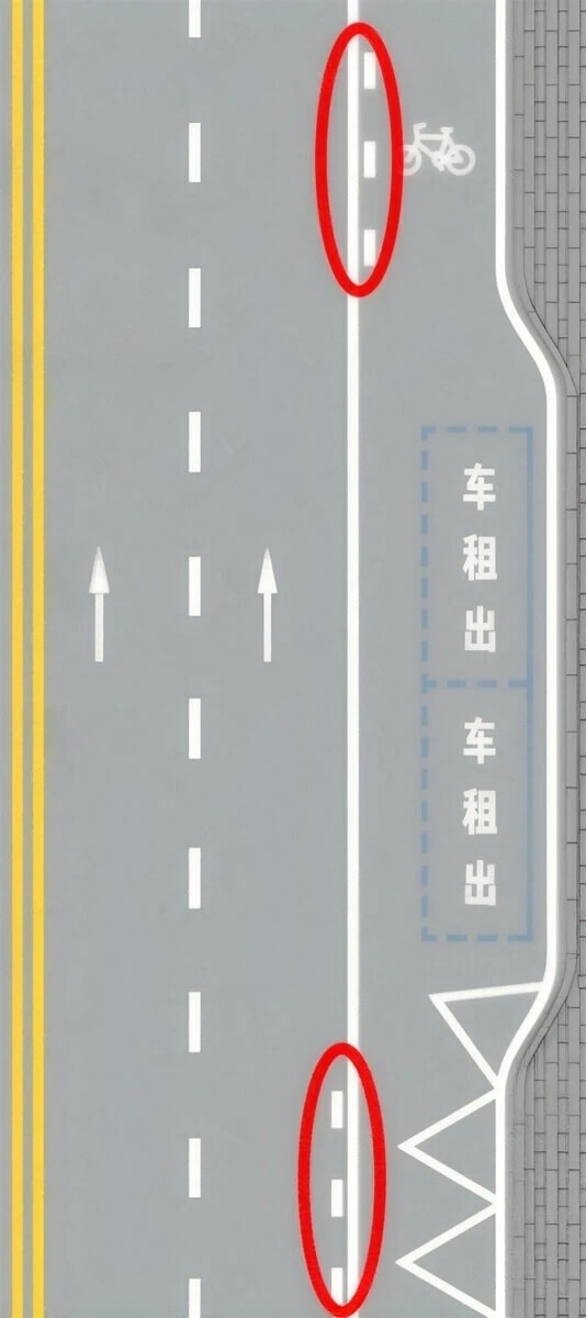红圈内标线表示虚线一侧机动车可临时变换车道进出港湾。