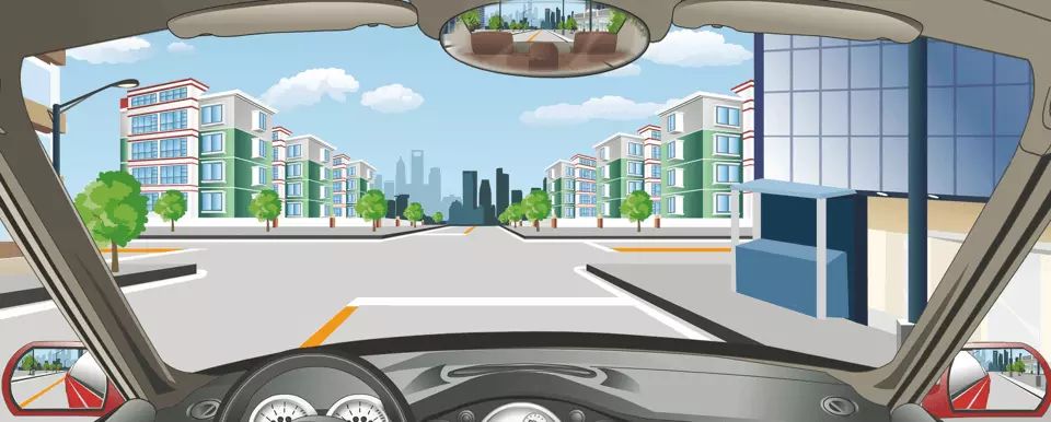 如图所示，驾驶机动车直行通过前方路口怎样行驶？